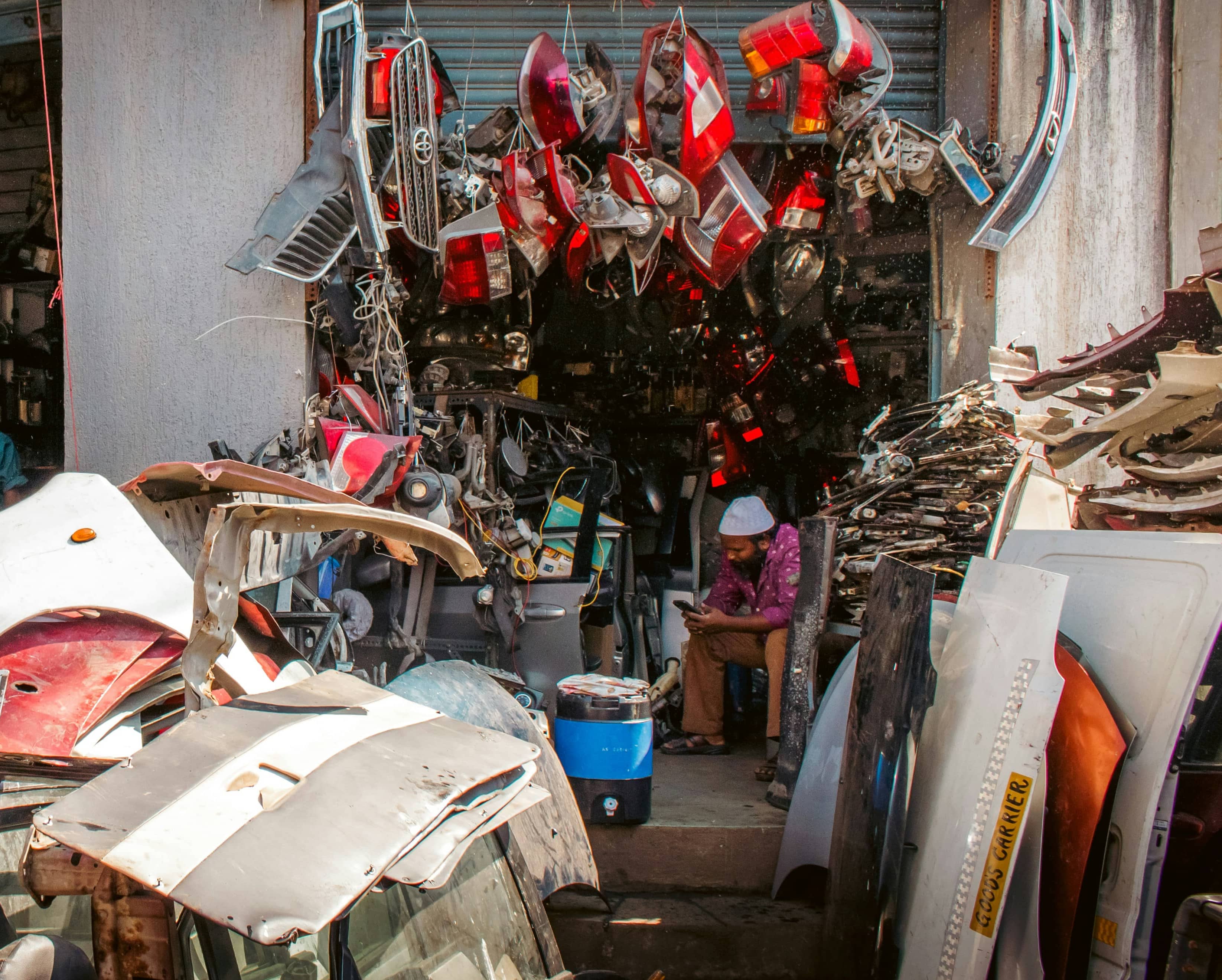 Car parts stacked in a busy Nigerian auto parts market